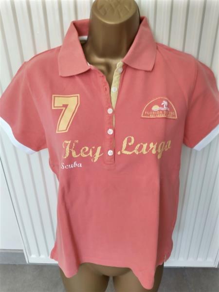 Grote foto pompelmoeskleurige polo met sportieve print kleding dames tops